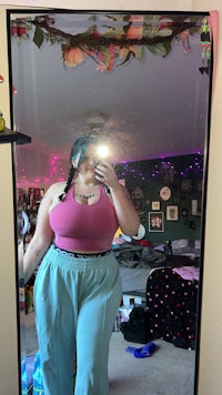 a woman taking a selfie in a mirror