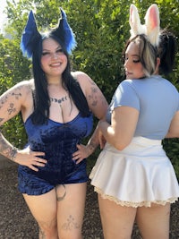 two women in cosplay posing for a picture